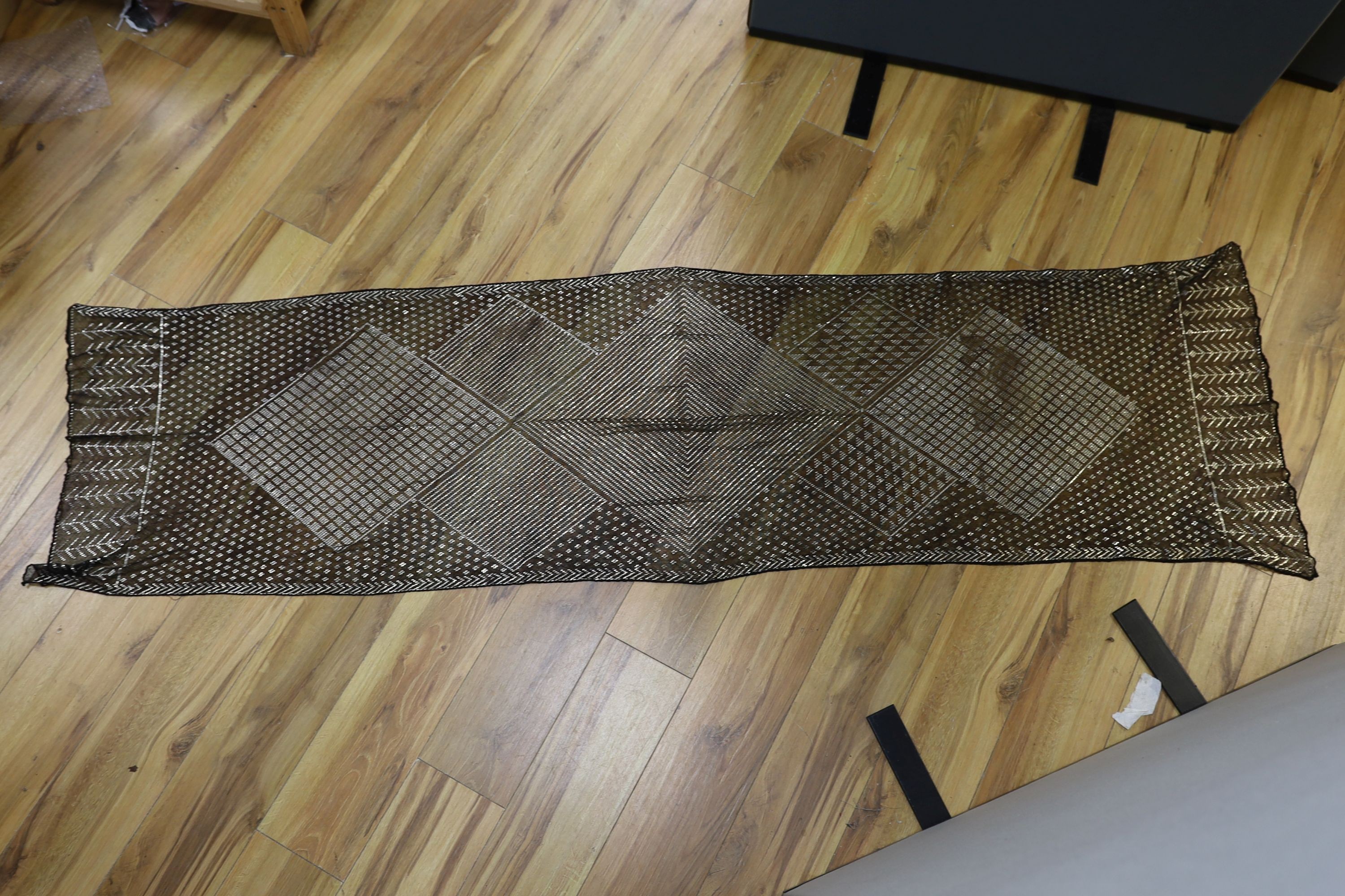A dress made from a metal and black net Egyptian shawl; a similar shawl and a piece of shawl